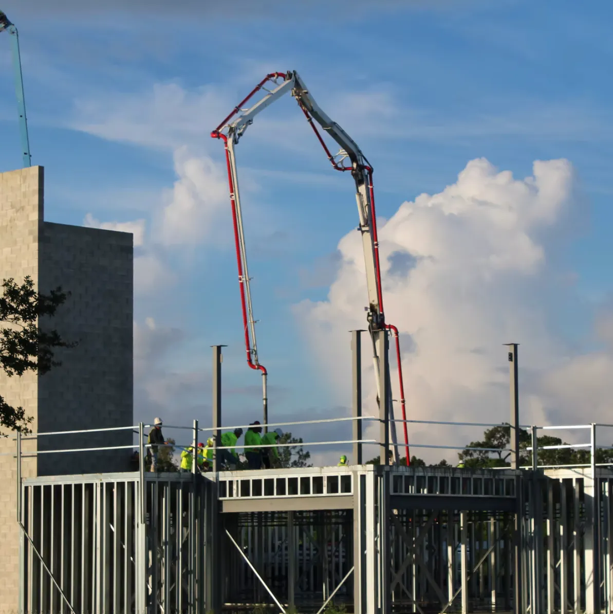 Large Concrete Pump pushing slurry to 3rd level of high rise